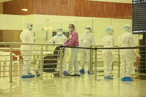 Non-Resident Keralites arriving at Cochin airport after COVID-19 forced restrictions are eased 