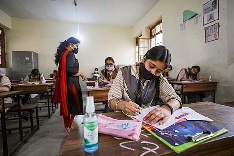 Students wearing face masks appearing  for class 10 board exams amid spike in coronavirus cases in Jammu