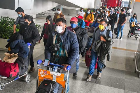 Indian nationals, evacuated from Ukraine, walk out of the Indira Gandhi International Airport