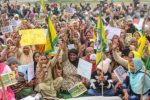 A large group of women holding up placards during a protest against farm laws in Patiala