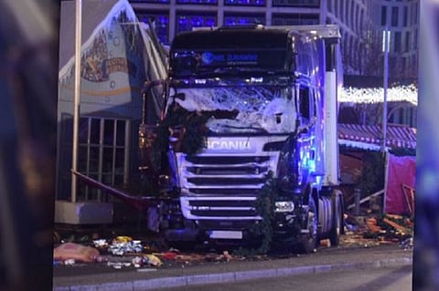 Germany on edge after truck plows into Berlin Christmas market, killing 12