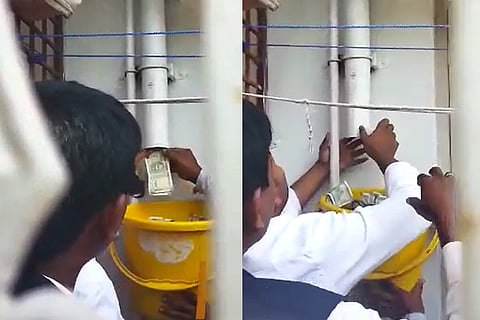 Screenshot from the video which shows cash seized from drain pipe in Kalaburagi