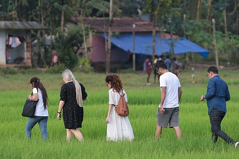 An image of a few tourists walking in Kerala