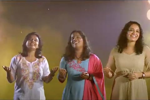 Three women playback singers singing 
