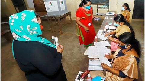 Representative image of people casting their vote