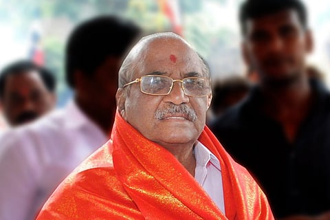Senior AIADMK leader and party presidium chairman Madhusudanan facing the camera