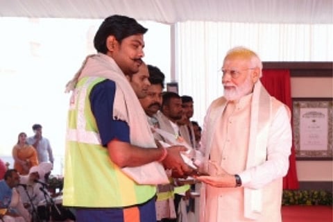 PM Modi felicitates workers involved in making of new Parliament House