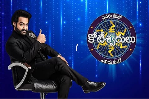 Jr NTR is seen in a black suit in the promo of 'Evaru Meelo Koteeswarulu'.