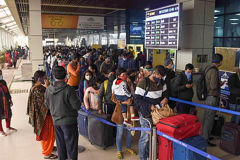 Passengers stand in queues at Jaiprakash Narayan Airport in  Patna in Dec 2020 