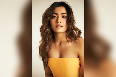 Rashmika Mandanna sports an elegant look in a yellow tube top in the photo.