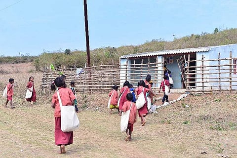 Tribal children in Rolugunta in Andhra attend a school