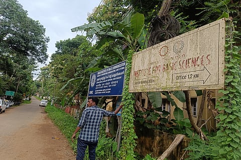 Faded signboard of the Srinivasa Ramanujan Institute of Basic Sciences in Kottayam, Kerala