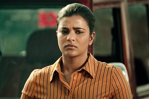 Aishwarya Rajesh in an orange brown shirt in Thittam Irandu