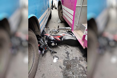 Kerala men evade death by a whisker as bike falls between two buses