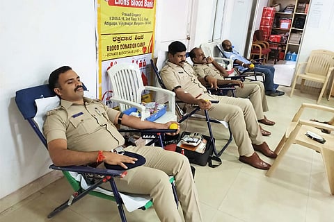 Policemen donating blood