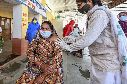 Woman in rural India gets Covid vaccine shot