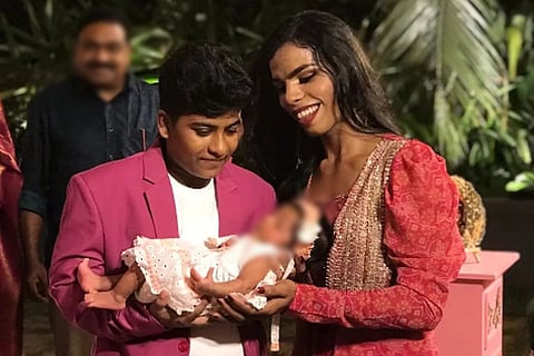 Zahhad and Ziya with their baby