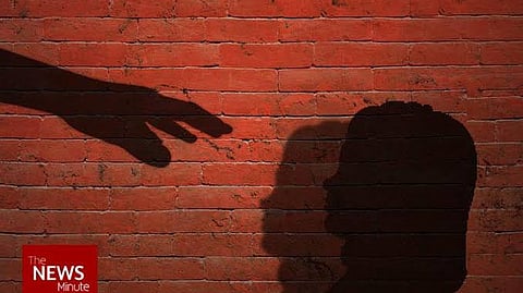 Silhouette of child and a hand reaching out to the child's face