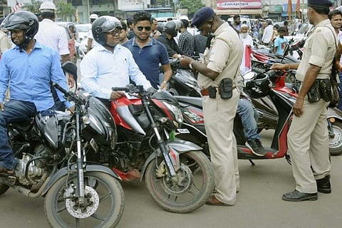 Traffic cops collecting fine