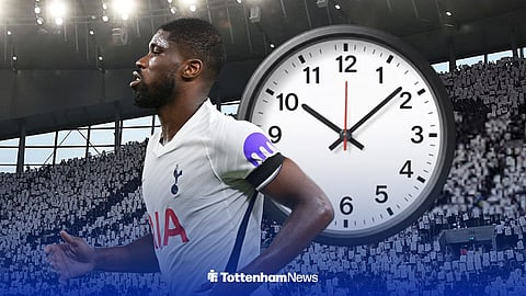 Tottenham's Kevin Danso next to a ticking clock with Tottenham Hotspur Stadium in the background