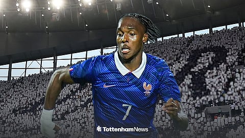 Tottenham's Mathys Tel in action for France with Tottenham Hotspur Stadium background