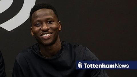 Tottenham loanee Pape Matar Sarr posing as he signs Juventus contract