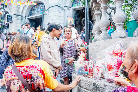 Photograph by Yummie Dingding for the Daily Tribune @tribunephl_yumi
Images of the Holy Child are being sold at Tondo Church in Tondo, Manila on Sunday as celebrations for the Feast of Sto. Niño in the country commences.