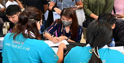 (FILES) A job applicant completes the necessary forms for employment at SM City Grand Central in 2023
