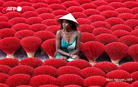 Quang Phu Cau, on the outskirts of Hanoi, is among several villages across Vietnam involved in the ancient incense stick trade, with many families living down its small alleys involved in the dying, drying or whittling down of the bamboo bark.