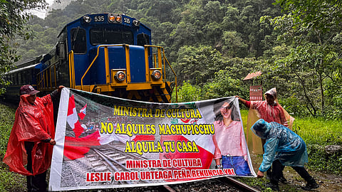 Launching what they called an "indefinite strike," tour operators and residents closed shops and blocked the tracks of a tourist train, compelling those on board to don rain jackets and walk the remaining three kilometers (1.9 miles) to the entrance.