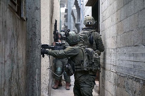 This handout picture released by the Israeli army on January 29, 2024, shows Israeli soldiers operating in Khan Yunis, in the southern the Gaza Strip, amid ongoing battles between Israel and the Palestinian militant group Hamas.