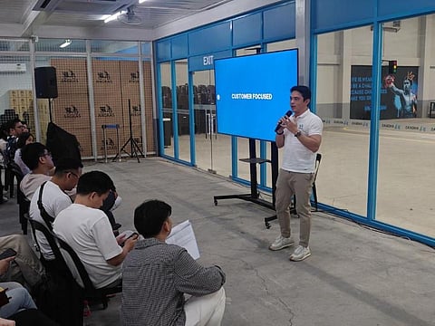 Angkas CEO George Royeca speaks to partners in a recent town hall meeting entitled ‘2024 and Beyond’ to discuss future business plans, which include the introduction of four-wheel services.