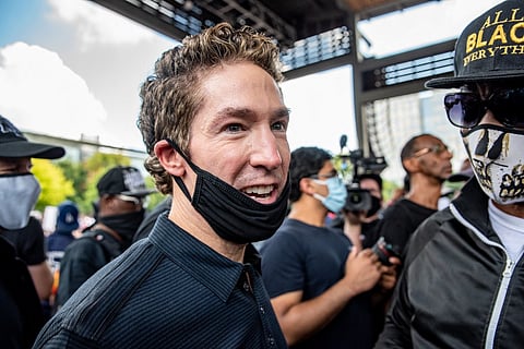(FILES) Pastor Joel Osteen arrives before a march in honor of George Floyd on 2 June 2020 in Houston, Texas.