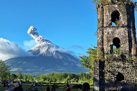 MAYON Volcano spews ash as seen from the famed Cagsawa church ruins in the town of Daraga, Albay Province, following a phreatic eruption over the weekend.