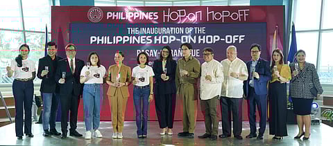 SM Supermalls’ President Steven Tan (6th from right) and Department of Tourism Secretary Christina Frasco (6th from left), along with partners including DOT National Capital Region Regional Director Sharlene Batin, Tourism Promotions Board Chief Operating Officer Marga Nograles, Pasay City Councilor Joey Calixto Isidro, Positive Exposure Productions founder Marinel Lee, and SMX Convention Center Vice President Michael Jaey Albana, toast at the inauguration of the DOT’s Hop-On Hop-Off newest stop, the Entertainment Hub, held recently at the SM Mall of Asia.
