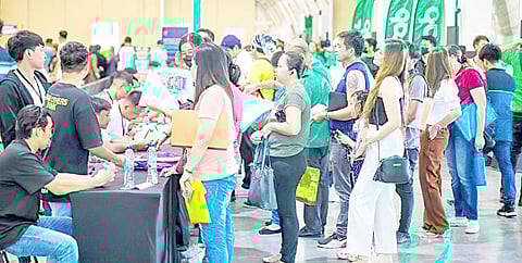Grab Philippines has created thousands of livelihood opportunities for aspiring TNVS drivers and operators, shown above queueing to submit required documents.