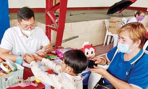 
MUNTINLUPA residents, including this young boy get free medical checkups under the Oplan Alaga Plus of the city government in various barangays.