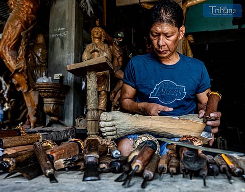Carving saints in Paete