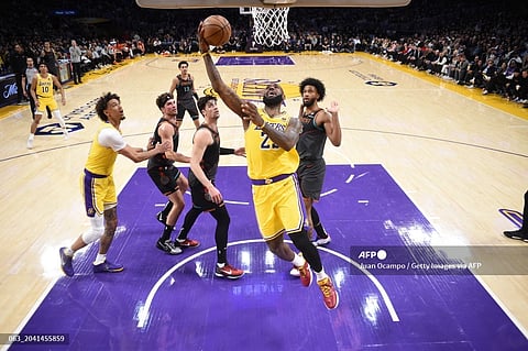 LeBron James #23 of the Los Angeles Lakers goes to the basket during the game on February 29, 2024, at Crypto.Com Arena in Los Angeles, California. 
