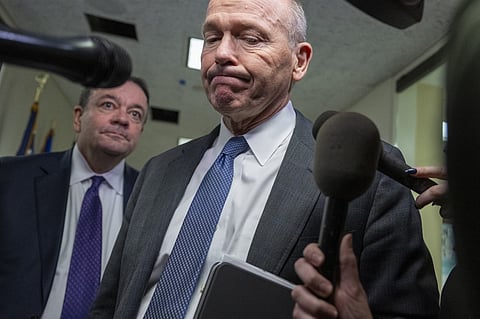 (FILES) Boeing CEO Dave Calhoun speaks with reporters on Capitol Hill in Washington, DC, on 24 January 2024, before meeting with a group of senators. Boeing announced on 25 March 2024 that Calhoun will leave the company at the end of the year.
