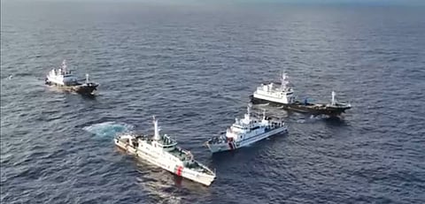 Tense standoff A screengrab from dramatic aerial footage captured by the Philippine Coast Guard shows Chinese vessels blocking and firing water cannons at a Filipino supply ship near Second Thomas Shoal on Saturday. The high-stakes encounter raises tensions in the disputed waters. 