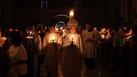 LOOK: Catholic Devotees attend the easter vigil as presided by Bishop Renato Mayugba at St. Williams Cathedral in Laoag City on Saturday, 30 March. Bishop Mayugba blessed the Easter Fire and from it the Pascal Candle, which is then brought into the darkened church.