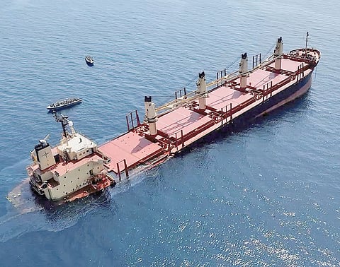 HANDOUT picture provided by the Yemeni Al-Joumhouriya TV on 26 February 2024, shows the Rubymar cargo ship sinking off the coast of Yemen. The Belize-flagged, British-registered and Lebanese-operated cargo ship carrying combustible fertilizer, was damaged in a missile strike on 25 February claimed by the Iran-backed Houthi rebels in Yemen. 