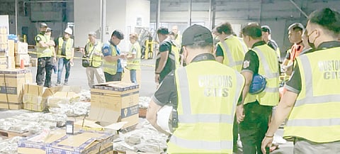 MEMBERS of the Philippine Drug Enforcement Agency (PDEA) inspect the balikbayan boxes where P238.2-million worth of 'kush' were found by elements of the Bureau of Customs Intelligence and Investigation Service (BOC-IIS)