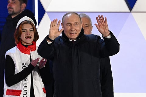 Russian President and presidential candidate Vladimir Putin addresses the crowd during a rally and a concert celebrating the 10th anniversary of Russia's annexation of Crimea at Red Square in Moscow on March 18, 2024.
