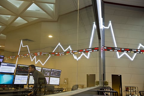(FILES) An employee monitors share prices at the Jakarta Stock Exchange on 29 September 2015. 