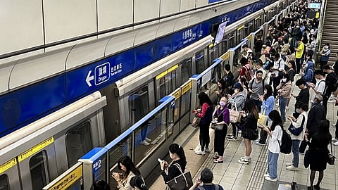 This photo taken and released by Taiwan’s Central News Agency (CNA) on 3 April 2024 shows commuters on a Taipei Mass Rapid Transit (MRT) platform as transport was temporary stopped following a 7.4 magnitude earthquake that hit Taiwan's east.
