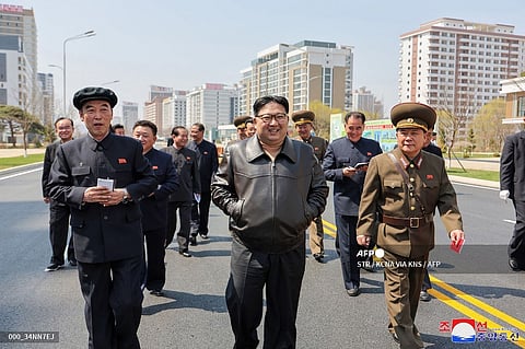 This picture taken on 5 April 2024 and released from North Korea's official Korean Central News Agency (KCNA) via KNS on 6 April 2024 shows North Korea's leader Kim Jong Un (C) inspecting the construction site of a second phase of 10,000 houses in a district of Pyongyang.
