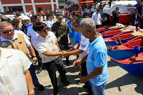 PRESIDENT Ferdinand Marcos Jr. leads the distribution of assistance to farmers, fisherfolks and indigenous people of Occidental Mindoro in the town of San Jose on Tuesday. 