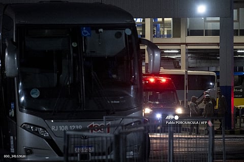 Police officers stand guard outside the Novo Rio bus terminal after a gunman hold passengers hostage in Rio de Janeiro, Brazil on 12 March 2024. A man who injured two people and took 17 bus passengers hostage at Rio de Janeiro's main station surrendered after three hours of kidnapping, police said Tuesday. "The kidnapper surrendered to the military police, he is detained, all the hostages were released, they are safe," Colonel Marco Andrade told reporters outside the Novo Rio terminal in the city center.
